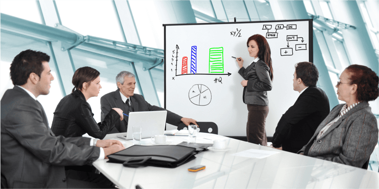 Business people having on presentation at office. Businesswoman presenting on whiteboard.