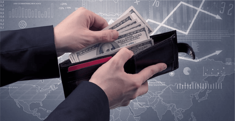 Businessmans hand takes out dollar from wallet with finance graphic on the background