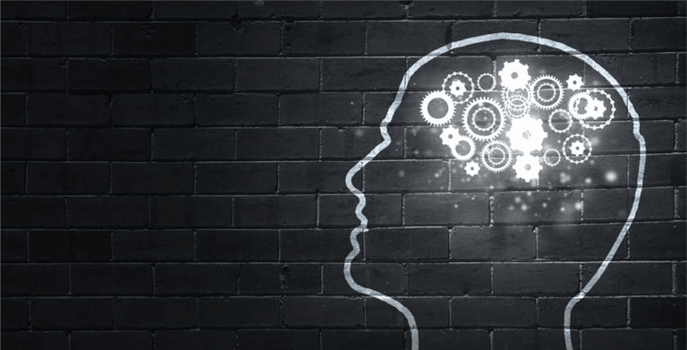 Silhouette of human head with gears instead of brain